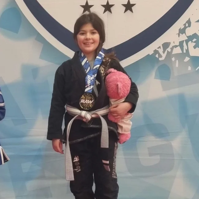 Audrey with her gold medal at RAW Grappling 2025